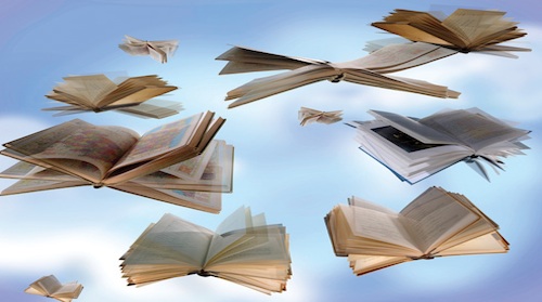 libros abiertos flotando en el cielo